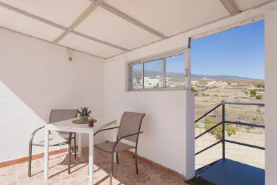 img/masonry/siwa-oasis-apartment/Apartamento sillon terraza vistas montaña.webp